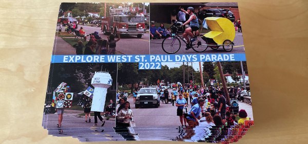 Stack of postcards featuring the 2022 Explore West St. Paul Days Parade