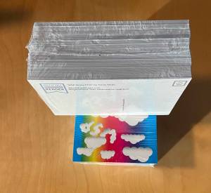 Stack of postcards with back viewable.