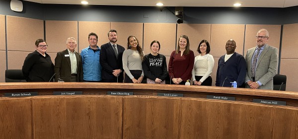 ISD 197 School Board with their outgoing student representatives.